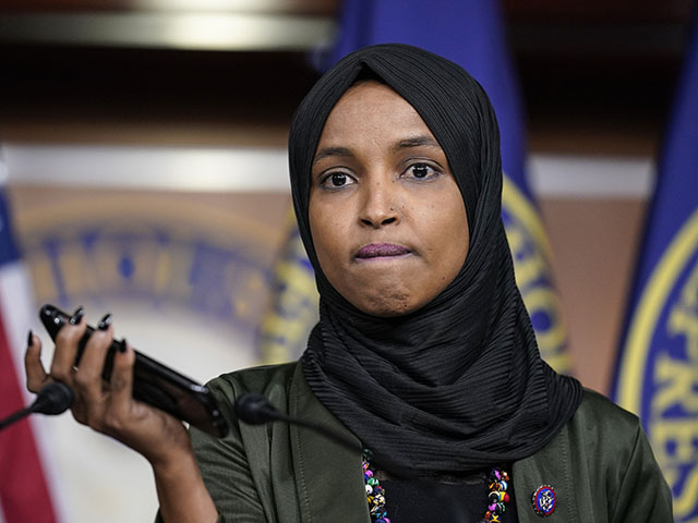 Rep. Ilhan Omar, D-Minn., plays a recording of a death threat left on her voicemail in the wake of anti-Islamic comments made last week by Rep. Lauren Boebert, R-Colo., who likened Omar to a bomb-carrying terrorist, during a news conference at the Capitol in Washington, Tuesday, Nov. 30, 2021. (AP Photo/J. Scott Applewhite)